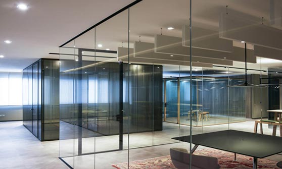 What are glass partition walls and room dividers